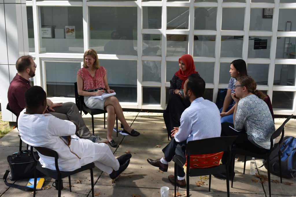 Students sitting in a circle on chairs